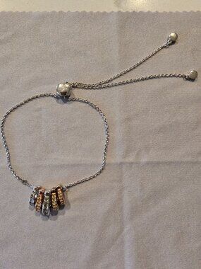 COACH slider charm C bracelet multi tone